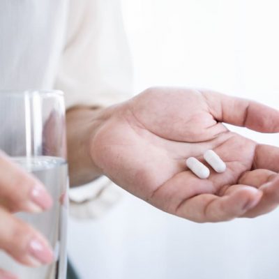 Closeup,Woman,Hand,Taking,Probiotics,,Prebiotics,To,Fight,An,Infection,