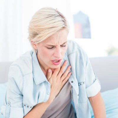 Pretty,Blonde,Woman,Having,Breath,Difficulties,In,The,Living,Room